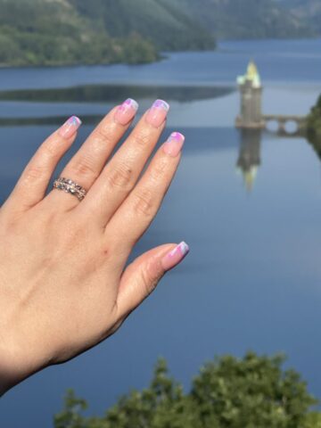July 2024 Engaged! Matt took Carolyn to the lake that flooded a Welsh town in 1888 so Liverpool had water. Getting down on one knee on the bridge across Lake Vyrnwy during the sunset, 8 years later on the date they met.